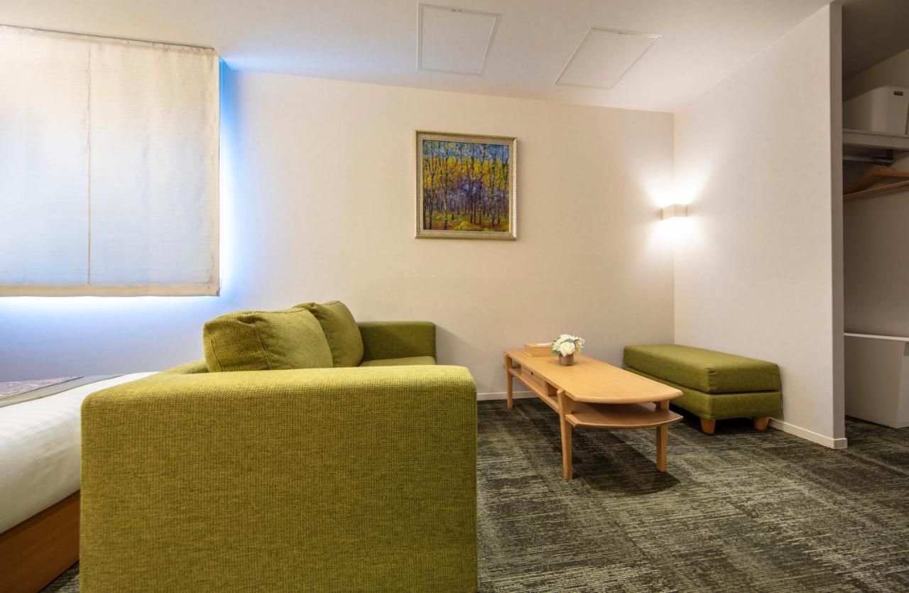 Grand Base Okayama Ekimae Aparthotel Exteriör bild