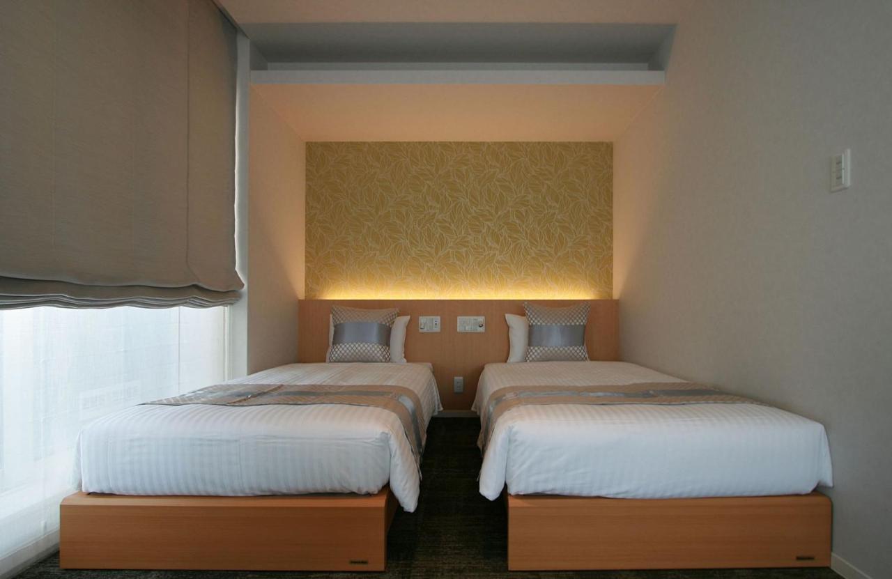 Grand Base Okayama Ekimae Aparthotel Exteriör bild