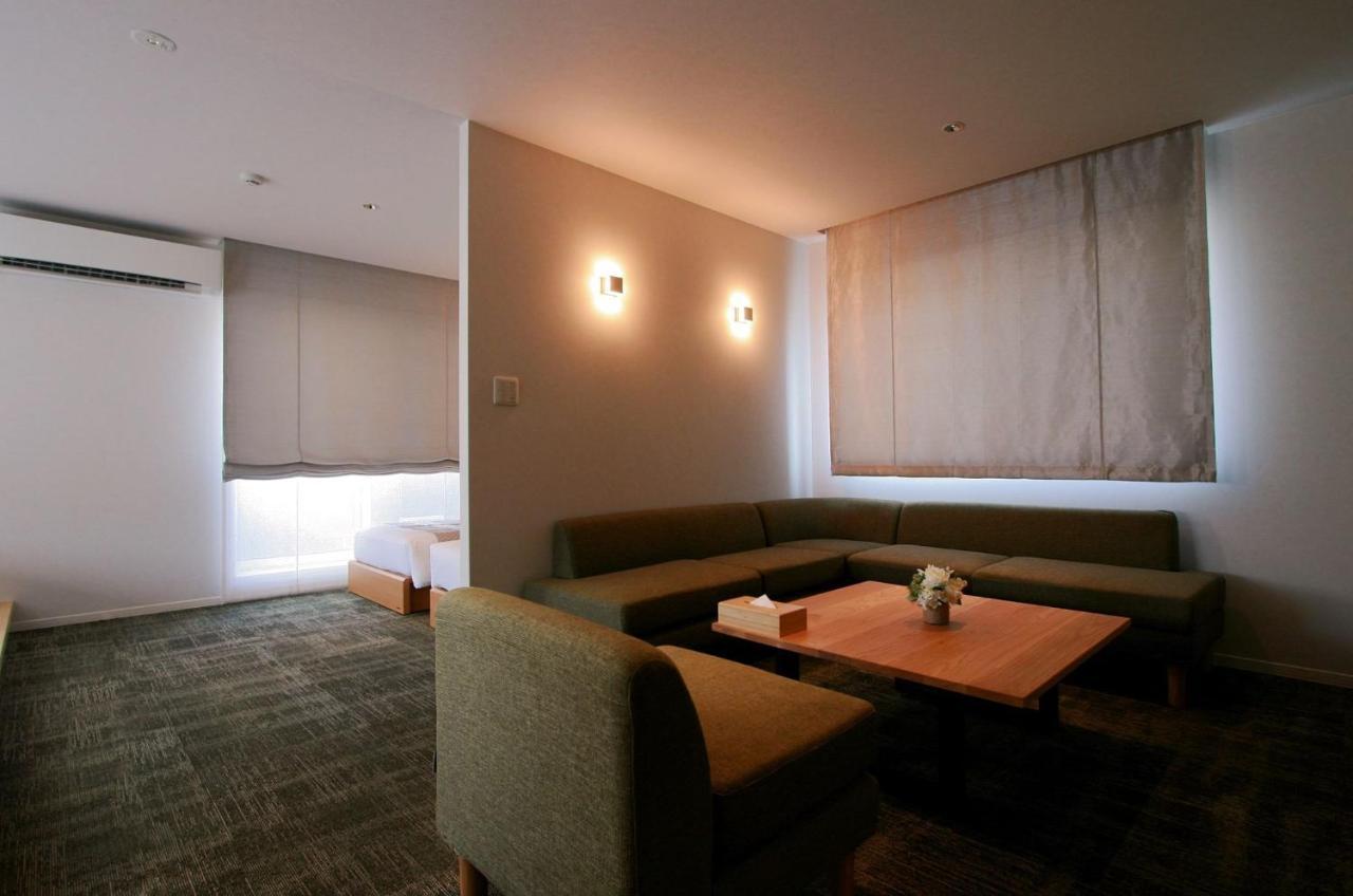 Grand Base Okayama Ekimae Aparthotel Exteriör bild