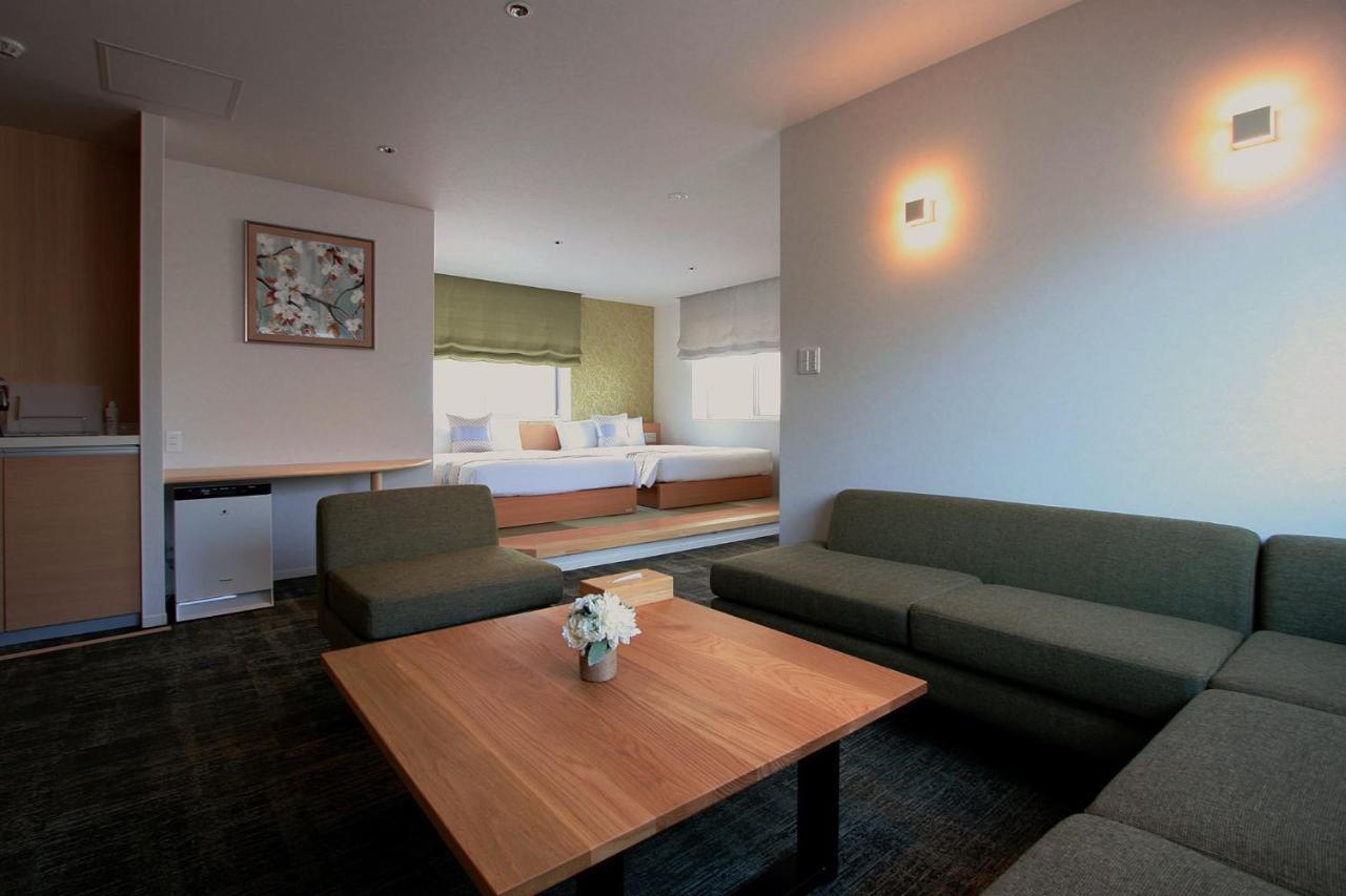 Grand Base Okayama Ekimae Aparthotel Exteriör bild