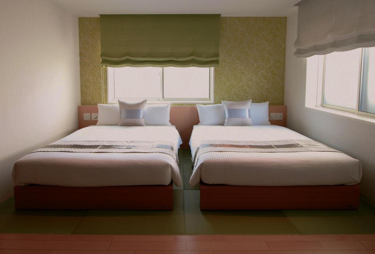 Grand Base Okayama Ekimae Aparthotel Exteriör bild