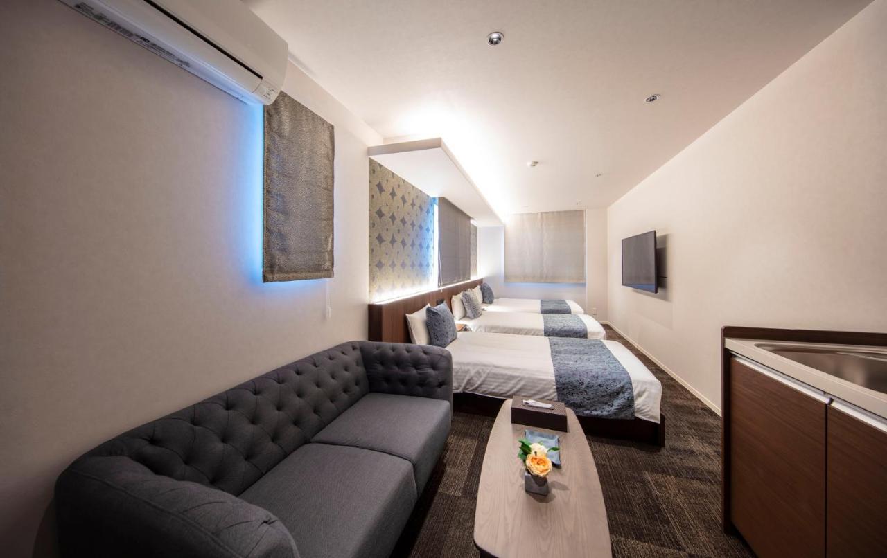 Grand Base Okayama Ekimae Aparthotel Exteriör bild
