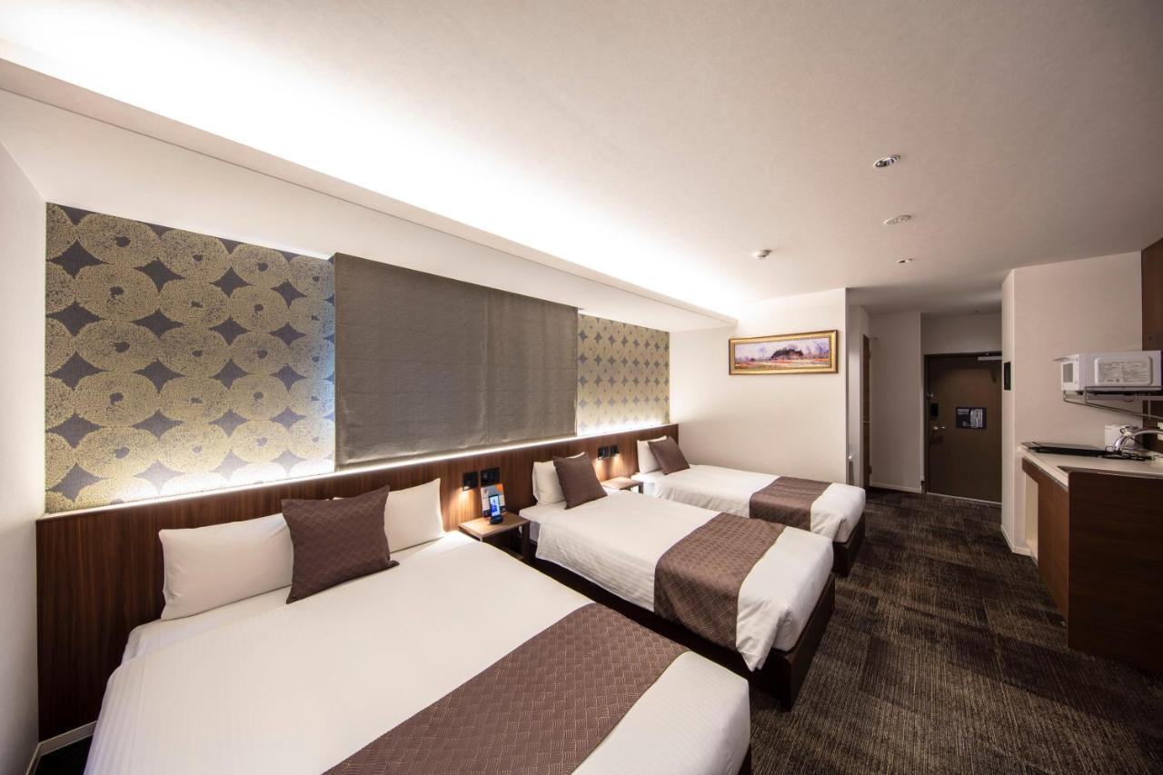 Grand Base Okayama Ekimae Aparthotel Exteriör bild