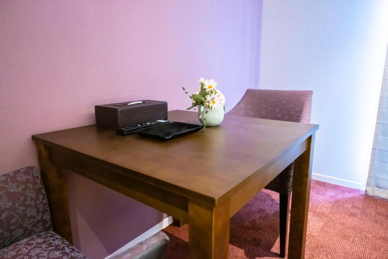 Grand Base Okayama Ekimae Aparthotel Exteriör bild
