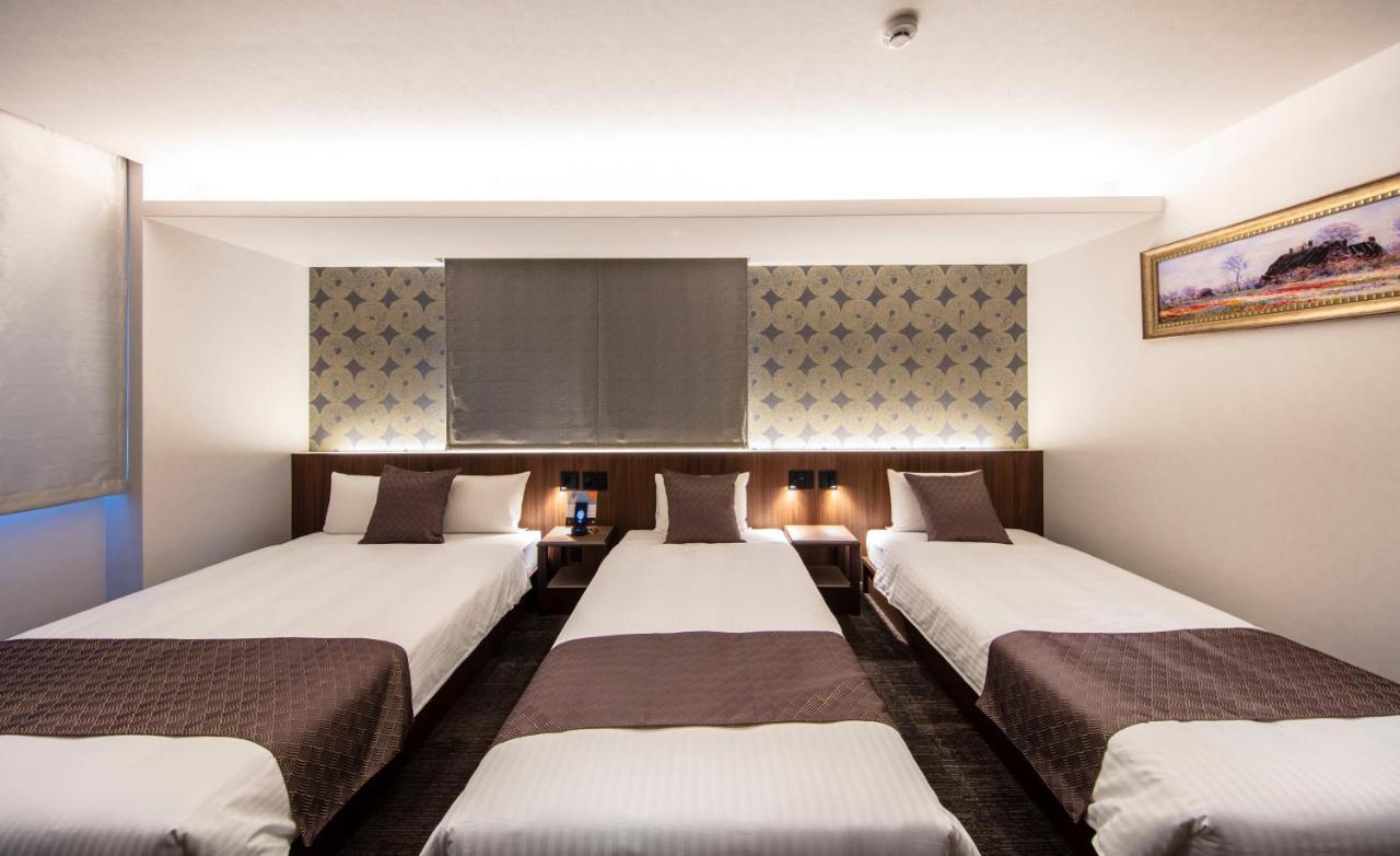 Grand Base Okayama Ekimae Aparthotel Exteriör bild