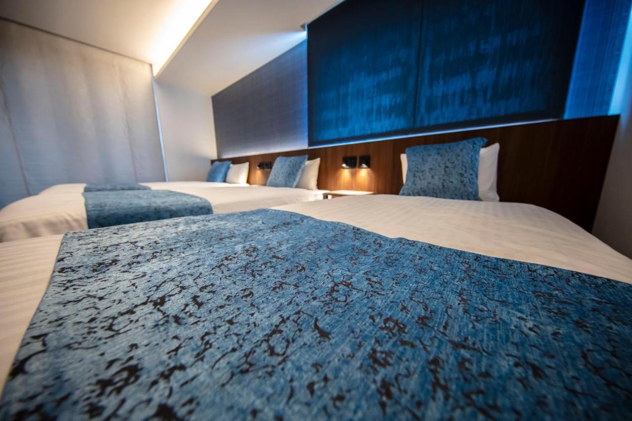 Grand Base Okayama Ekimae Aparthotel Exteriör bild