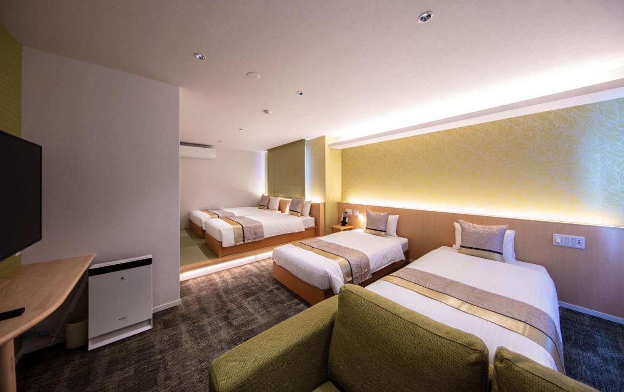 Grand Base Okayama Ekimae Aparthotel Exteriör bild