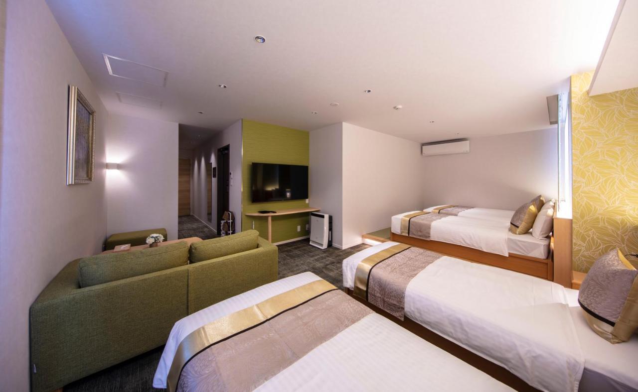 Grand Base Okayama Ekimae Aparthotel Exteriör bild