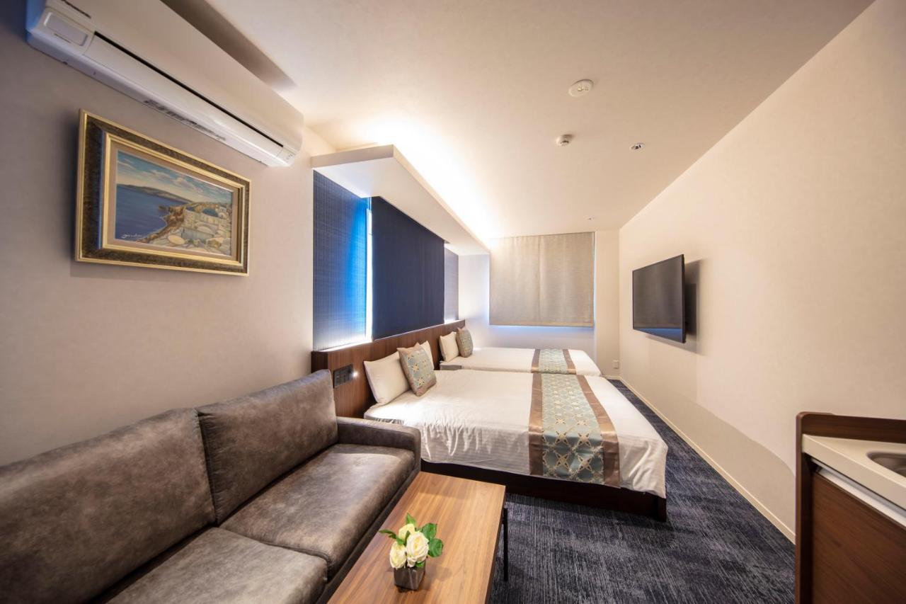 Grand Base Okayama Ekimae Aparthotel Exteriör bild